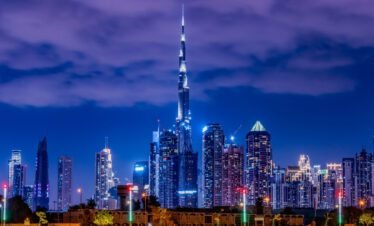 Burj Khalifa and Dubai skyline illuminated at night