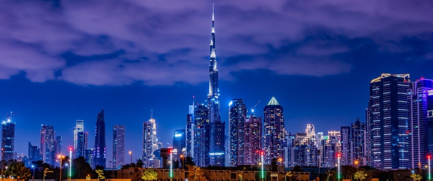 Burj Khalifa and Dubai skyline illuminated at night